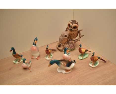 Border Fine Arts 'Tawny Owl and Owlet' studies number 039 alongside a group of three Beswick Pottery pheasants and a group of