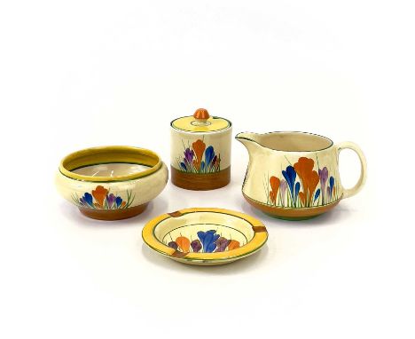 A collection of Clarice Cliff 'Crocus' pattern ceramics.   Comprising of a jug, bowl, preserve pot with cover, and an ash tra