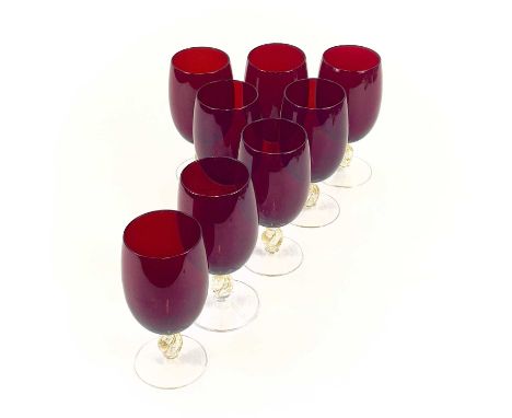 A set of eight Venetian glass wine glasses. With ruby bowls and gilt flecked stems. Height 15cm.