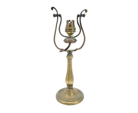 A ships brass wall mounted gimbal lamp. Length 27cm.