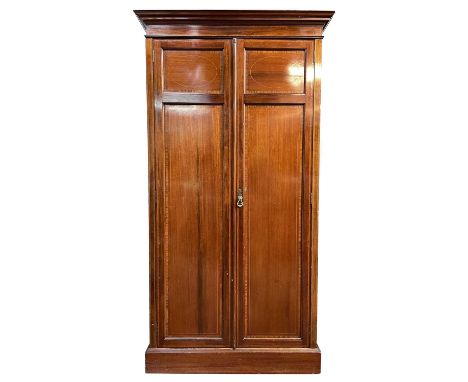 A late Victorian mahogany and satinwood banded wardrobe. With two panel doors on a plinth base, height 201.5cm, width 107cm, 