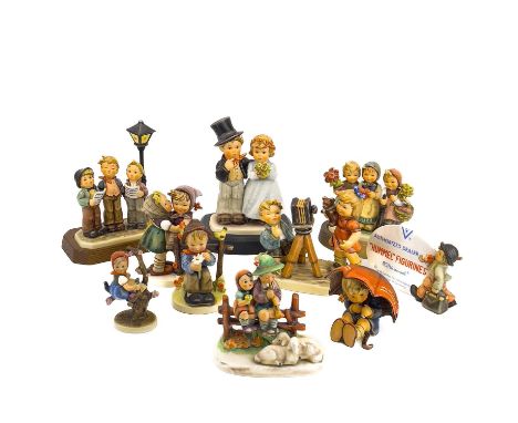 A collection of ten Hummel porcelain figures. Including Camera Ready, Dearly Beloved, Umbrella Girl, Trio of Wishes, Telling 