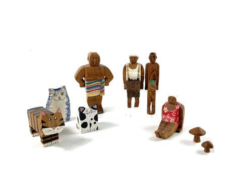 LYN MUIR A collection of wood carved and painted figures amusingly decorated as holidaymakers and animals. together with a ce