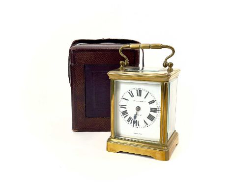 A French brass cased carriage timepiece, retailed by Mappin &amp; Webb, London. Circa 1900, with travel case, height 15cm.The