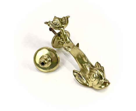 A Victorian brass dolphin door knocker. Height 23cm, with turned stud.