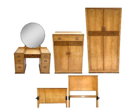 A Maple &amp; Co Tottenham Court Road London Furniture bedroom suite Including a satinwood and amboyna dressing table with a 