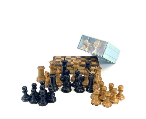 A Staunton type boxwood and ebony weighted chess set. Circa 1900, the king height 8.5cm, together with another turned set and