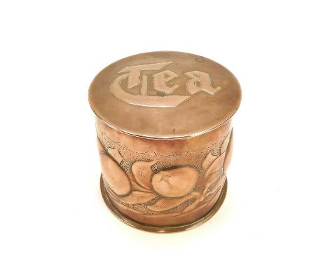 A Newlyn copper cylindrical tea caddy and cover. Repousse decorated with a band of medlars on a punched ground, the cover sta