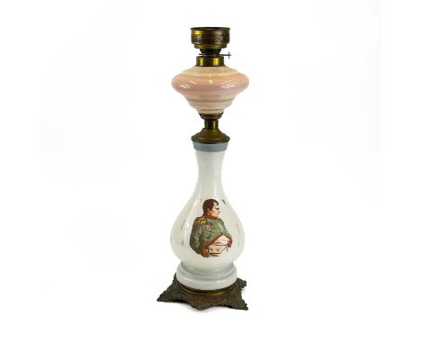 A French opaque glass oil lamp. Circa 1900, printed with a portrait of Napoleon, on a gilt metal base, height 57cm.