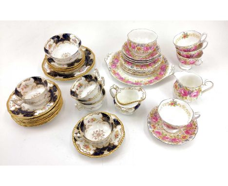 Coalport porcelain batwing pattern part tea service. Comprising: milk jug, sugar bowl, two salad plates, five teacups, five s