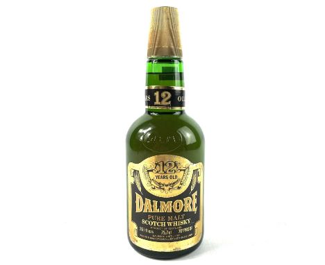 A bottle of Dalmore 12 Years old pure malt Scotch whiskey. 26 3/4 fl-ozs 70% Proof.