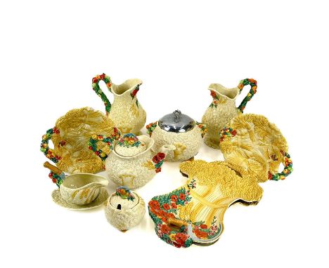 A collection of Clarice Cliff Celtic Harvest pottery. Including teapot and cover, biscuit barrel, sugar and cover, pair of ju