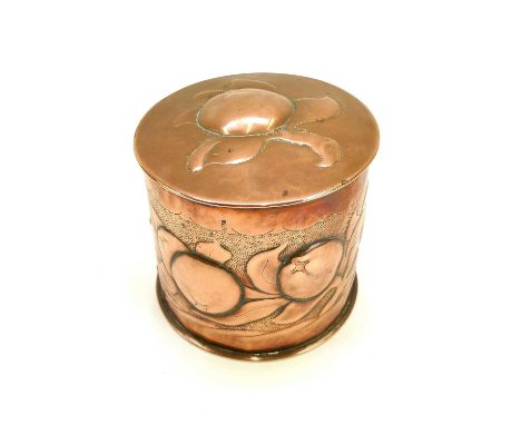 A Newlyn copper cylindrical tea caddy and cover. Repousse decorated with medlars on a punched ground, height 11cm.