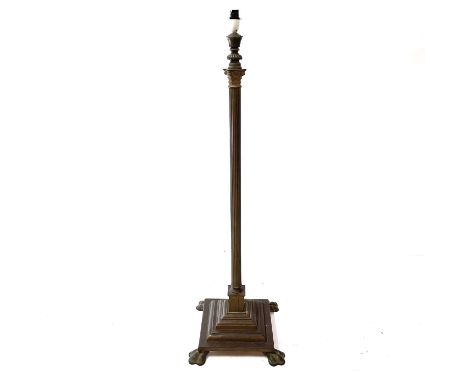 A Victorian brass Corinthian column lamp standard. Raised on a stepped square base, height 121cm, converted to electricity.