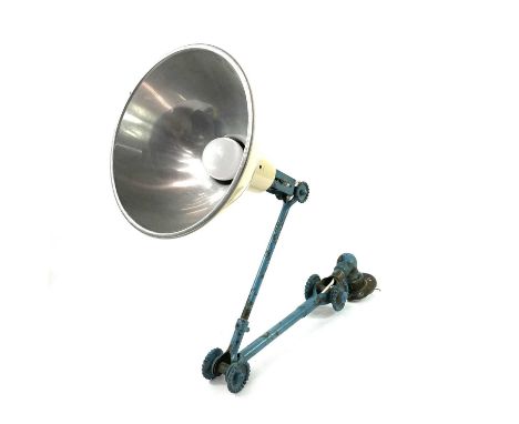 A Dugdills industrial machinist wall mounted lamp with later enamel shade. Approximate length excluding shade 95cm.