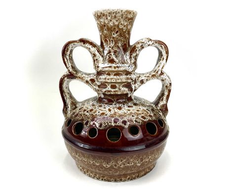 A large Fosters Newlyn pottery lamp base. With twin handles and pierced design to the globular body, height 38cm.