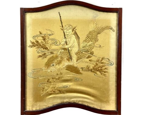 An early 20th silk embroidered panel decorated with an imp riding on a carp's back. 57cm x 53cm.