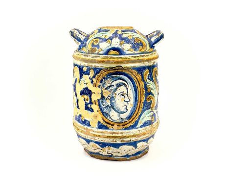 A Maiolica portrait jar. 17th/18th century, with twin handles and a portrait medallion with flowers and foliage on a blue gro