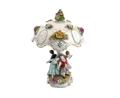 A German porcelain figural flower encrusted table lamp and shade. Circa 1960s, the shade with lithophane panels and the base 