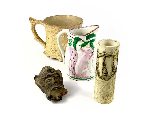 A 19th-century Staffordshire porter mug moulded with processional exotic animals. Height 11cm, together with a Sunderland pin