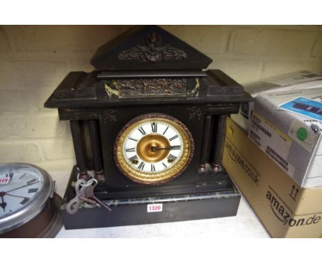 An Ansonia slate and marble architectural mantel clock, 40cm high.