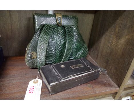 A vintage green snake skin handbag; together with an Agfa camera. (2)