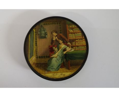 A 19th century Stobwasser style papier mache circular snuff box and cover, the top printed with a scene from Rob Roy, 9cm dia