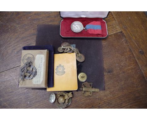 Medals: an interesting group of badges and medals, to include: a Commando badge, with compass verso; a cased Imperial Service