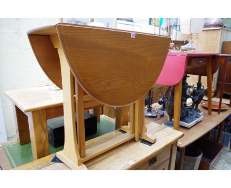 An Ercol pale elm gateleg table, 83cm wide; together with a set of three matching chairs. 