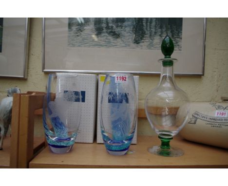 A Dartington decanter and stopper; together with a pair of Caithness etched glass vases, 20cm high, both boxed.  