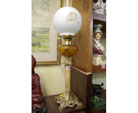An alabaster and brass oil lamp. 