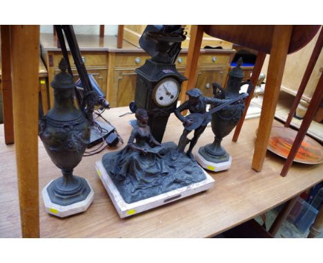 A Louis XVI style spelter and marble clock garniture, with painted enamel dial, 50cm high.