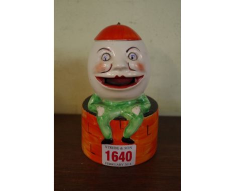 A 1930s novelty pottery Humpty Dumpty figural stamp licker, possibly Carltonware, 12.5cm high. 