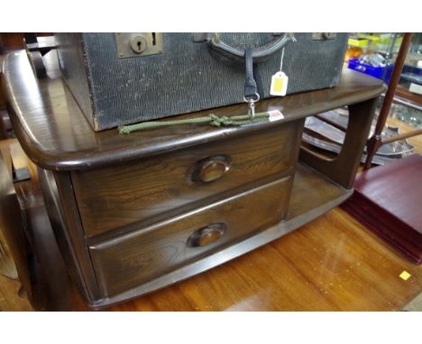 An Ercol coffee table, with two drawers to one side, 77cm wide.