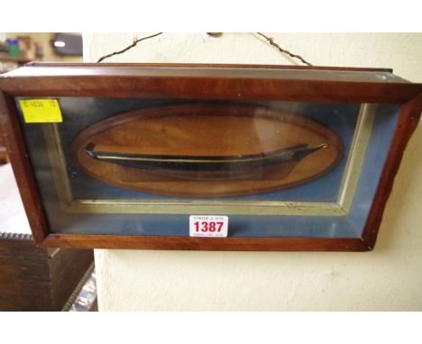 An antique mahogany framed half hull model, 29cm wide.  Condition Report: CASE: 29cm wide.  14.5cm long.  5cm deep.  Hull 19c