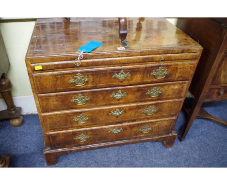 A small 18th century walnut and line inlaid four drawer chest, with caddy top and brushing slide, 79.5cm wide.Provenance: bea