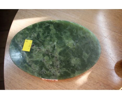 A Chinese green jade wine set, comprising a pot and cover; four bowls; and an oval tray, 20cm wide.  Condition Report: All pi