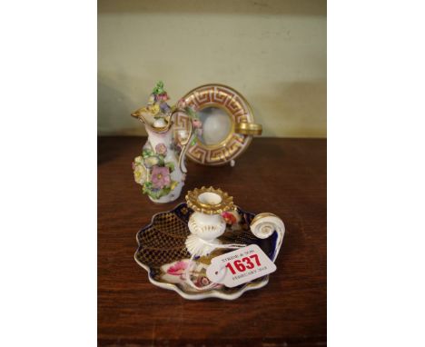 A Regency porcelain Roman lamp; together with another 19th century porcelain chamberstick; and a Coalbrookdale style floral e