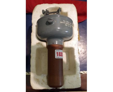 A Sestrel nautical compass, in polystyrene box and cover; together with a red ensign flag, on small mahogany mast.