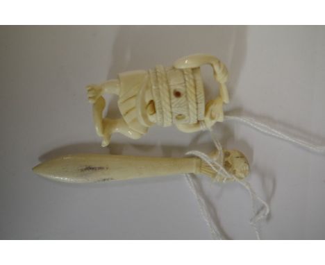 An unusual Japanese carved ivory netsuke, signed, 5.5cm; together with a bone paperclip. 