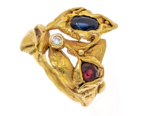 Designer-Ring Rubin-Saphir-Brillant GG 750/000 mit einem oval fac. Saphir 6,4 x 4,0 mm, Dunkelblau, einem rund fac. Rubin 5,2