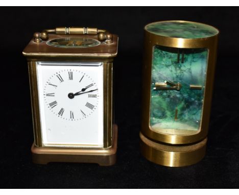 A BRASS CASED CARRIAGE CLOCK  11.5cm high with handle down, and a mid-century Swiza cylindrical carriage clock Condition Repo