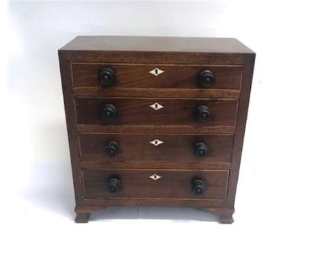 AN APPRENTICE PIECE CHEST OF FOUR LONG GRADUATING DRAWERS raised on bracket feet, 37cm x 30.5cm x 20cm