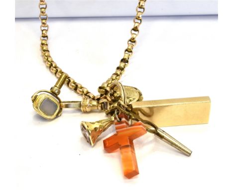 A LONG CHAIN CHARM NECKLACE Of mixed metal to include a marked 9ct gold ingot and a miniature yellow metal 'In Memory' hair l
