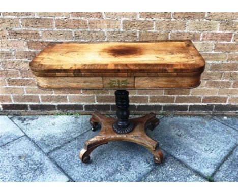 ROSEWOOD FOLDOVER CARD TABLE, with a central column and raised on a quadruped base with casters H 70 x W 91.5 x D 46cm