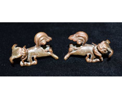 A PAIR OF SMALL CHINESE BRONZE FIGURES OF DRAGONS  5cm long Condition Report : the front legs are rather bent, but both unifo