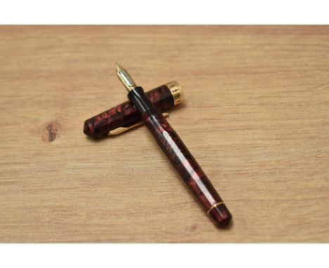 A Wahl Eversharp Doric (2nd Gen) piston fill fountain pen in burgundy and black marble having adjustable Eversharp The Wahl C