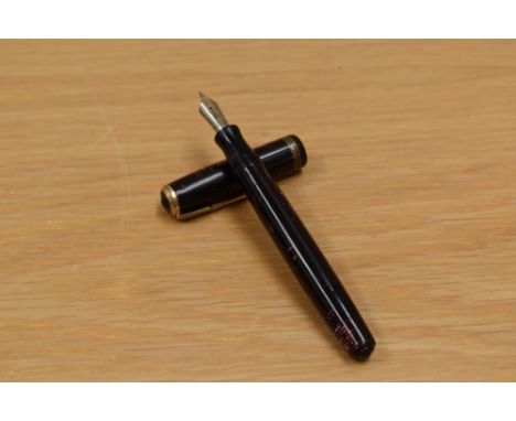 A Parker Vacumatic button fill fountain pen in red pearl with three band cap having Parker 46 arrow nib.