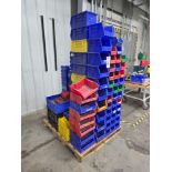 Assorted Plastic Storage Bins on Wooden Pallet