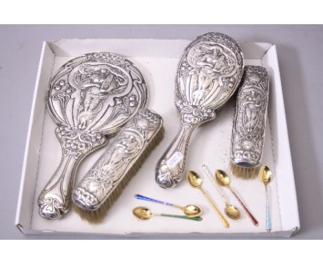 AN EDWARDIAN ART NOUVEAU STYLE SILVER BACKED FOUR PIECE DRESSING TABLE SET, embossed with stylised poppies surrounding a maid